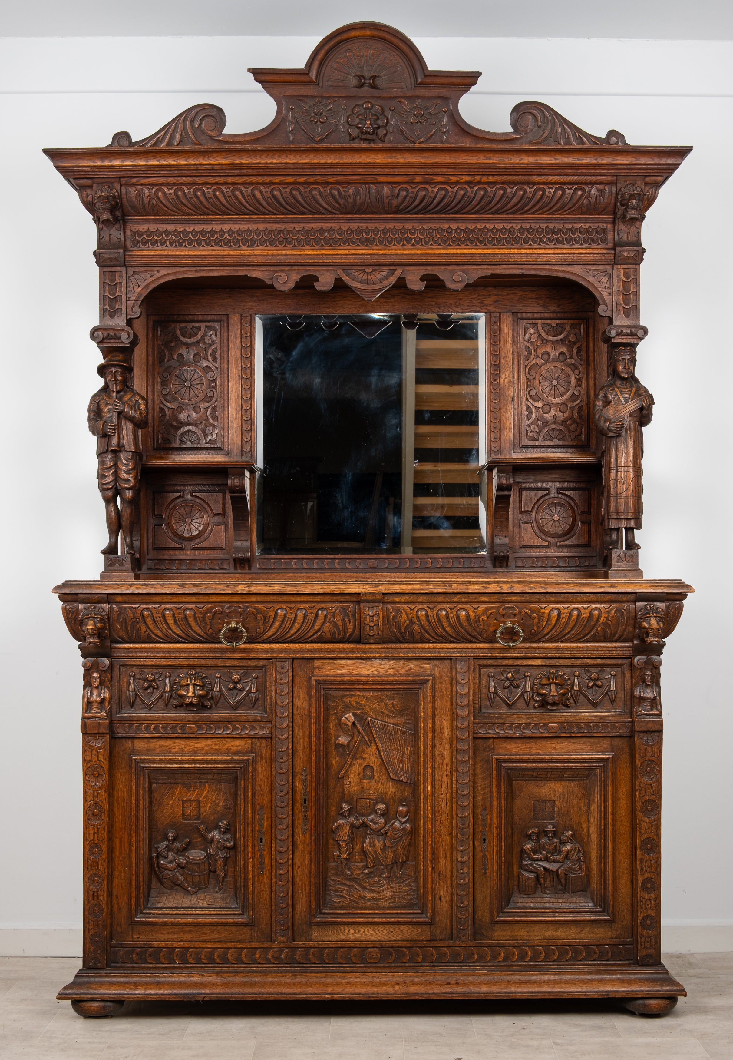 Antique Victorian carved oak mirror back sideboard buffet cabinet circa 1880 with figural musician carvings and decorative panels