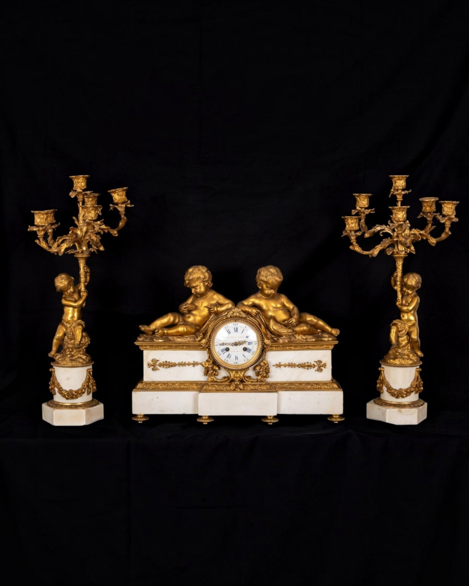 Fine 19th Century French Ormolu & White Marble Clock Garniture with Cherubs