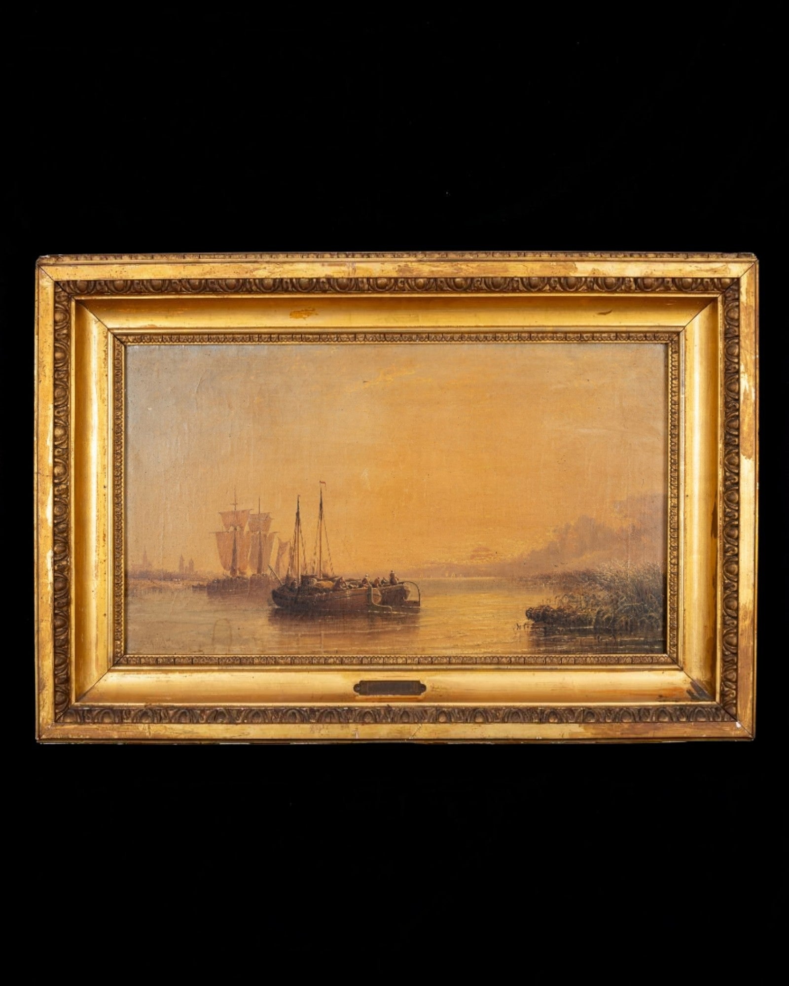Arthur Joseph Meadows signed 19th-century British marine oil painting in antique gilt frame depicting barges and sailing vessels on a calm river at sunset.