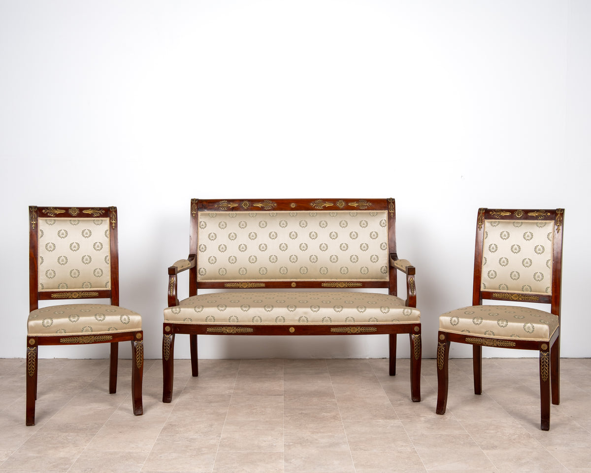 Antique French Empire Revival mahogany salon suite comprising a settee and two matching side chairs