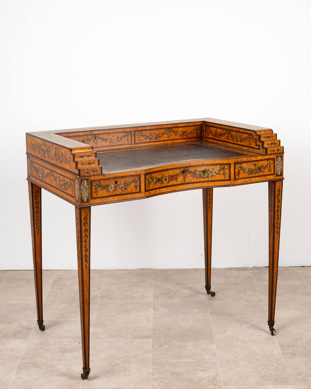 Antique painted satinwood Carlton House writing desk with stepped gallery and tapering legs