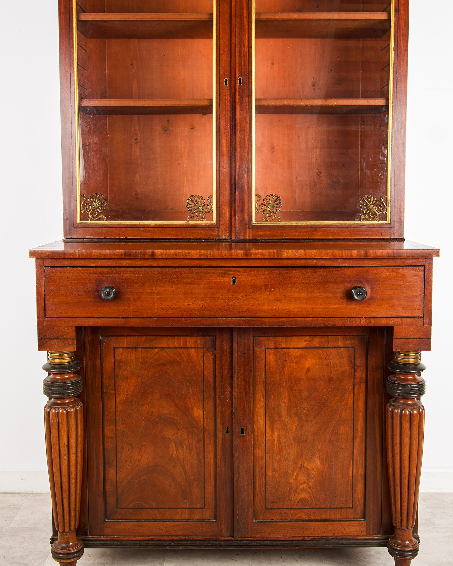 Regency Mahogany Bookcase Cabinet showing Ebonised Column Details and Original Brass Mounts - Hawkins Antiques