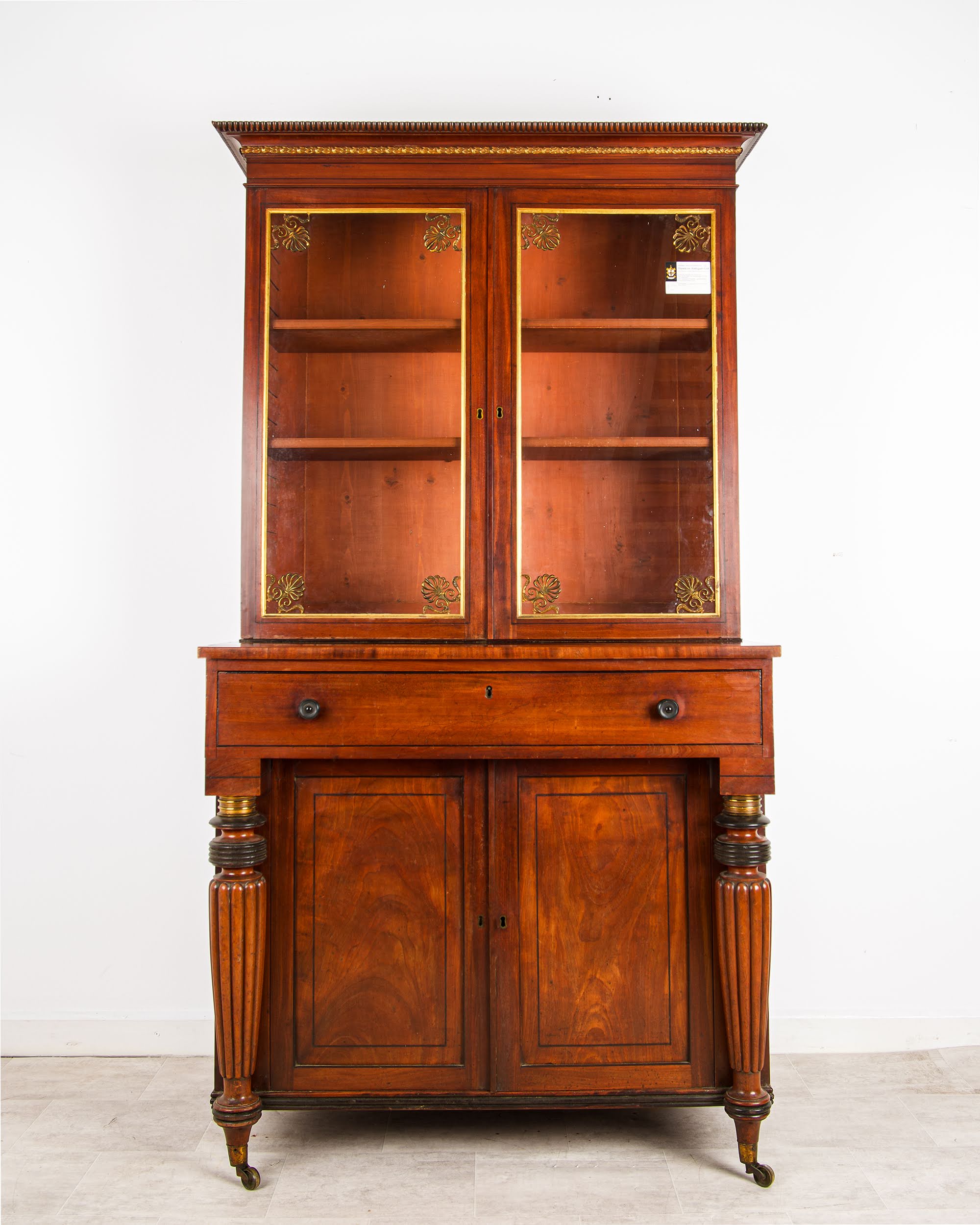Antique Regency Mahogany Glazed Bookcase Cabinet c.1815 - Brass Mounts, Ebonised Columns & Original Castors